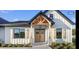 Charming home showcasing natural wood accents and a welcoming front porch at 112 Cr 532B, Bushnell, FL 33513