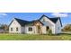 Charming home with a dark roof and a inviting front entrance at 112 Cr 532B, Bushnell, FL 33513