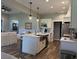 Bright, open kitchen with stainless steel appliances and a central island with a sink at 112 Cr 532B, Bushnell, FL 33513