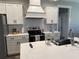 Modern kitchen with white cabinetry, stainless steel appliances, and a stylish backsplash at 112 Cr 532B, Bushnell, FL 33513