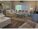 Bright living room featuring neutral colors, cozy sofas, and a beautiful rug at 112 Cr 532B, Bushnell, FL 33513