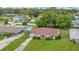 Charming single-story home with manicured lawn, brick accents, and mature landscaping at 1511 Avenue F Ne, Winter Haven, FL 33881