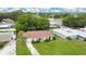 Aerial view of single-story home, showing the well-maintained lawn and neighborhood at 1511 Avenue F Ne, Winter Haven, FL 33881