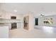 Bright kitchen features stainless steel appliances, light cabinetry, and an open layout to the living area at 1511 Avenue F Ne, Winter Haven, FL 33881