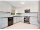 Modern kitchen with stainless steel appliances, light cabinetry, and sleek countertops at 1511 Avenue F Ne, Winter Haven, FL 33881