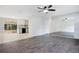 Bright living room featuring modern lighting, beautiful wood-look floors and a kitchen view at 1511 Avenue F Ne, Winter Haven, FL 33881