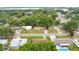 Aerial view showcasing single-Gathering homes, mature trees, and residential streets at 1511 Avenue F Ne, Winter Haven, FL 33881