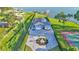Stunning waterfront home with well manicured grounds, spacious driveway, water access and pool and tennis court at 390 Windermere Dr, Lakeland, FL 33809
