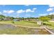 Expansive backyard view of the lakefront property, showcasing lush greenery and mature trees at 390 Windermere Dr, Lakeland, FL 33809