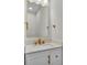 Modern bathroom vanity with gold fixtures, bright lighting, and updated hardware at 390 Windermere Dr, Lakeland, FL 33809
