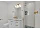 Bright bathroom with white vanity, marble countertop, and luxurious glass shower at 390 Windermere Dr, Lakeland, FL 33809