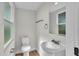 Cozy bathroom with a toilet, sink, and vanity at 390 Windermere Dr, Lakeland, FL 33809