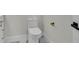 Modern half-bath with tile floors, white fixtures, and matte gold accents at 390 Windermere Dr, Lakeland, FL 33809