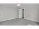Bright bedroom featuring plush carpeting, a ceiling fan, and a open doorway at 390 Windermere Dr, Lakeland, FL 33809