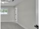 Bright bedroom featuring a ceiling fan, neutral tones, and two windows at 390 Windermere Dr, Lakeland, FL 33809