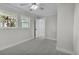 Bright bedroom featuring neutral walls, carpet, and ample natural light at 390 Windermere Dr, Lakeland, FL 33809