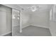 Bright bedroom featuring plush carpeting, a ceiling fan, and a closet with sliding mirror doors at 390 Windermere Dr, Lakeland, FL 33809