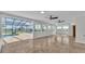 Large bonus room with tile flooring leads out to the pool at 390 Windermere Dr, Lakeland, FL 33809