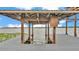 Wooden boat dock over the water with a covered structure for boat storage at 390 Windermere Dr, Lakeland, FL 33809