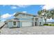 Beautiful two-story home with modern design, a two-car garage, and a well-manicured landscape at 390 Windermere Dr, Lakeland, FL 33809