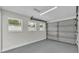 Clean and spacious garage with three windows and an automatic door at 390 Windermere Dr, Lakeland, FL 33809