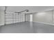 Large garage with high ceilings, an automatic door, and ample storage space at 390 Windermere Dr, Lakeland, FL 33809