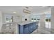 Open floor plan with a spacious kitchen island and lake views at 390 Windermere Dr, Lakeland, FL 33809