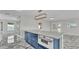 A kitchen island features an integrated oven and elegant countertops, perfect for modern cooking at 390 Windermere Dr, Lakeland, FL 33809