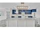 A kitchen with custom cabinets, an island, and stainless steel appliances combines style and functionality at 390 Windermere Dr, Lakeland, FL 33809