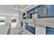 A modern kitchen features an island, stainless steel appliances, and elegant finishes throughout at 390 Windermere Dr, Lakeland, FL 33809