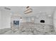 Open living space with modern lighting, fireplace and a view of the gorgeous luxury kitchen at 390 Windermere Dr, Lakeland, FL 33809