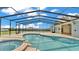 Screened pool and hot tub with water views at 390 Windermere Dr, Lakeland, FL 33809