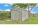 Outdoor shed with double doors, located in the backyard at 390 Windermere Dr, Lakeland, FL 33809