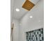 Modern white shower with rainfall shower head and stylish blue accent tiles at 390 Windermere Dr, Lakeland, FL 33809