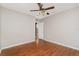 Bedroom with wood-look flooring, a closet, and an open doorway at 6898 Glenbrook Dr, Lakeland, FL 33811