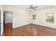 Bedroom featuring laminated floors, neutral paint and a ceiling fan at 6898 Glenbrook Dr, Lakeland, FL 33811