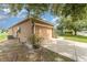 View of the side exterior highlighting the two-car garage and access to the driveway at 6898 Glenbrook Dr, Lakeland, FL 33811
