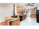 Spacious kitchen featuring granite countertops, wooden cabinets and modern appliances at 6898 Glenbrook Dr, Lakeland, FL 33811