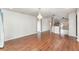 Open-concept living room with hardwood floors and view to the kitchen at 6898 Glenbrook Dr, Lakeland, FL 33811