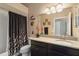 Bathroom featuring granite counters, and a shower/tub with curtain at 8360 Lake Amhurst Trl, Orlando, FL 32829