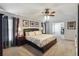 Comfortable bedroom with a ceiling fan, neutral decor, and natural light at 8360 Lake Amhurst Trl, Orlando, FL 32829