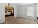 Bedroom featuring neutral colors and carpeted floors connected to office space at 8360 Lake Amhurst Trl, Orlando, FL 32829