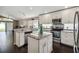 Well-lit kitchen with granite countertops, stainless steel appliances, and a center island at 8360 Lake Amhurst Trl, Orlando, FL 32829