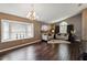 Bright living room with a large window, elegant lighting, and stylish decor at 8360 Lake Amhurst Trl, Orlando, FL 32829