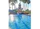 Sparkling pool with crystal clear water, a charming lighthouse-themed slide, and lush tropical surroundings at 8360 Lake Amhurst Trl, Orlando, FL 32829