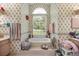 Well-lit bathroom with a soaking tub, large window, and floral wallpaper at 9530 Sw 189Th Ct, Dunnellon, FL 34432
