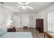 Bright bedroom with wood floors, closet, and natural light at 9530 Sw 189Th Ct, Dunnellon, FL 34432