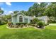 Charming single-story home with well-maintained landscaping at 9530 Sw 189Th Ct, Dunnellon, FL 34432