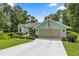 Charming single-story home with well-maintained landscaping and a spacious driveway at 9530 Sw 189Th Ct, Dunnellon, FL 34432