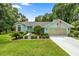 Charming single-story home with a well-maintained lawn, landscaping, and a two-car garage at 9530 Sw 189Th Ct, Dunnellon, FL 34432